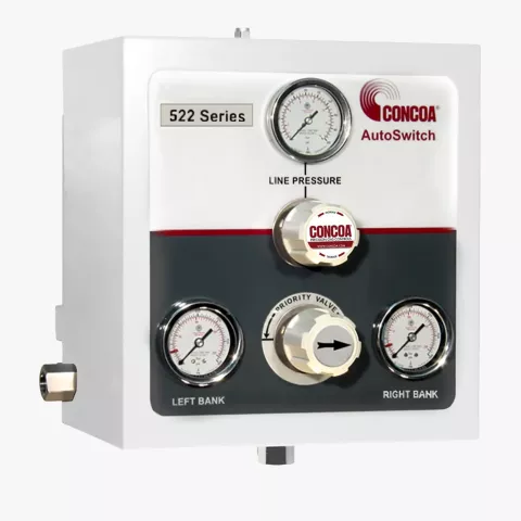 Enclosed pressure differential switchover with brass internals for high purity gas applications