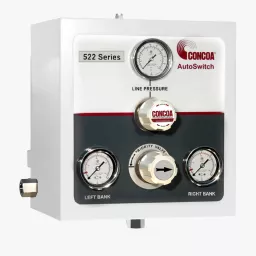 Enclosed pressure differential switchover with brass internals for high purity gas applications